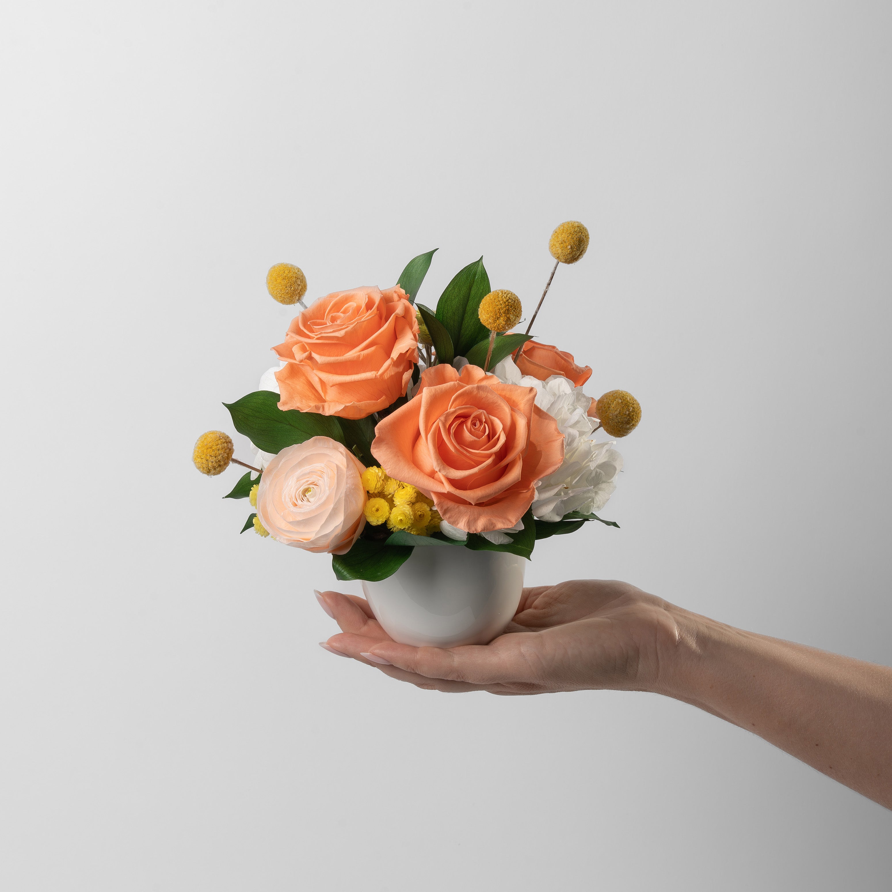 Preserved orange and peach flower arrangement for yachts 