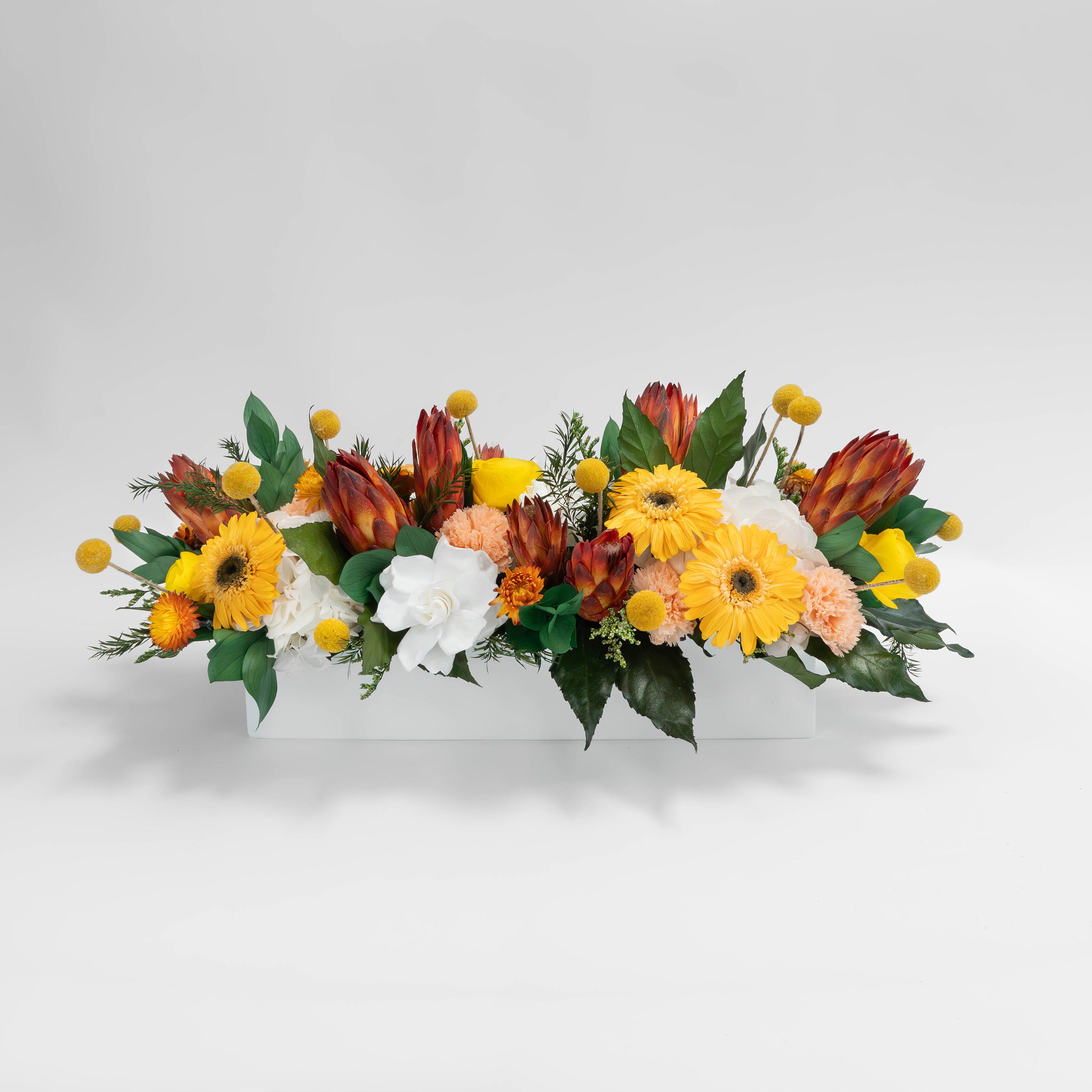 Preserved orange and yellow tropical long low flower arrangement for yachts 