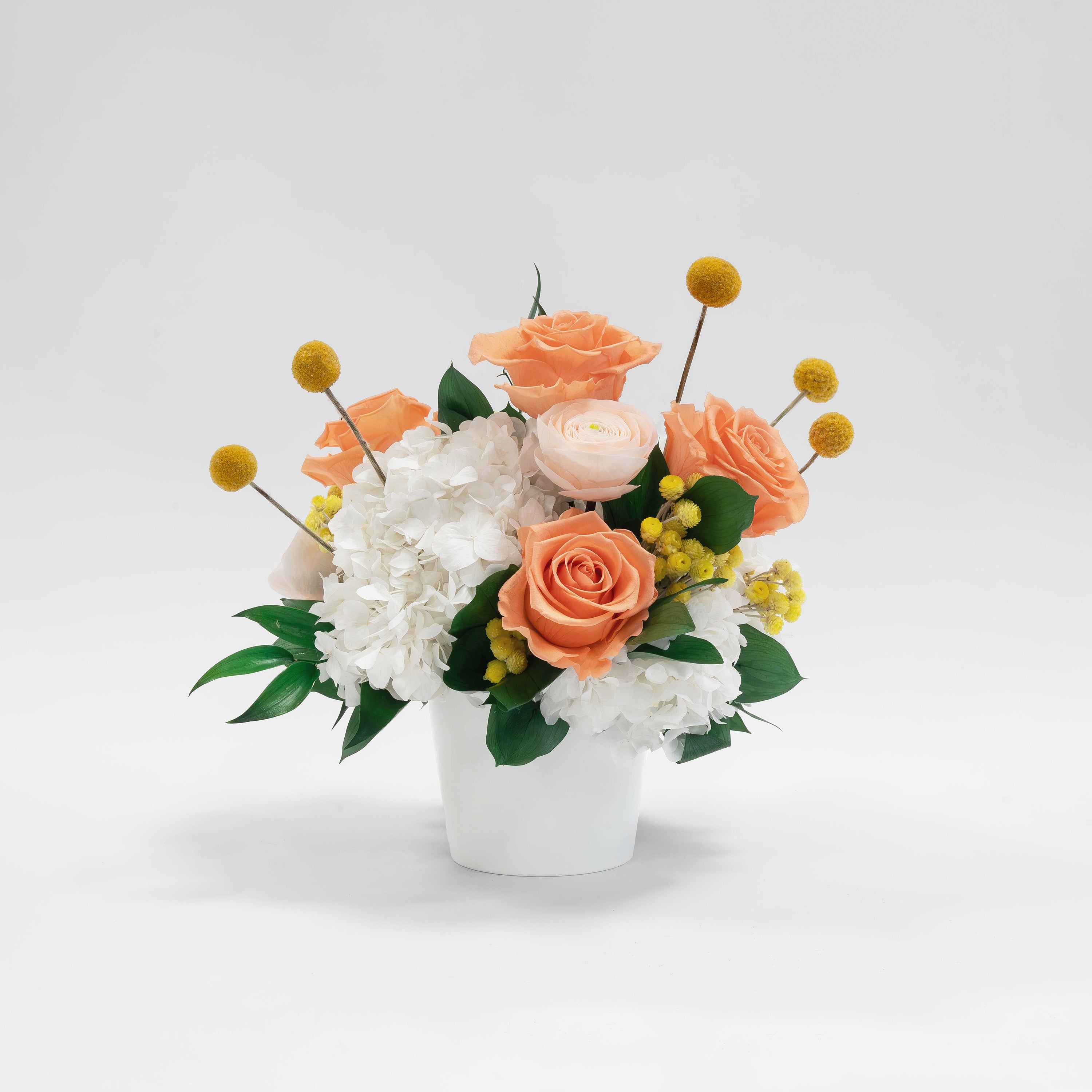 Preserved white and orange mixed tropical flower arrangement for yachts