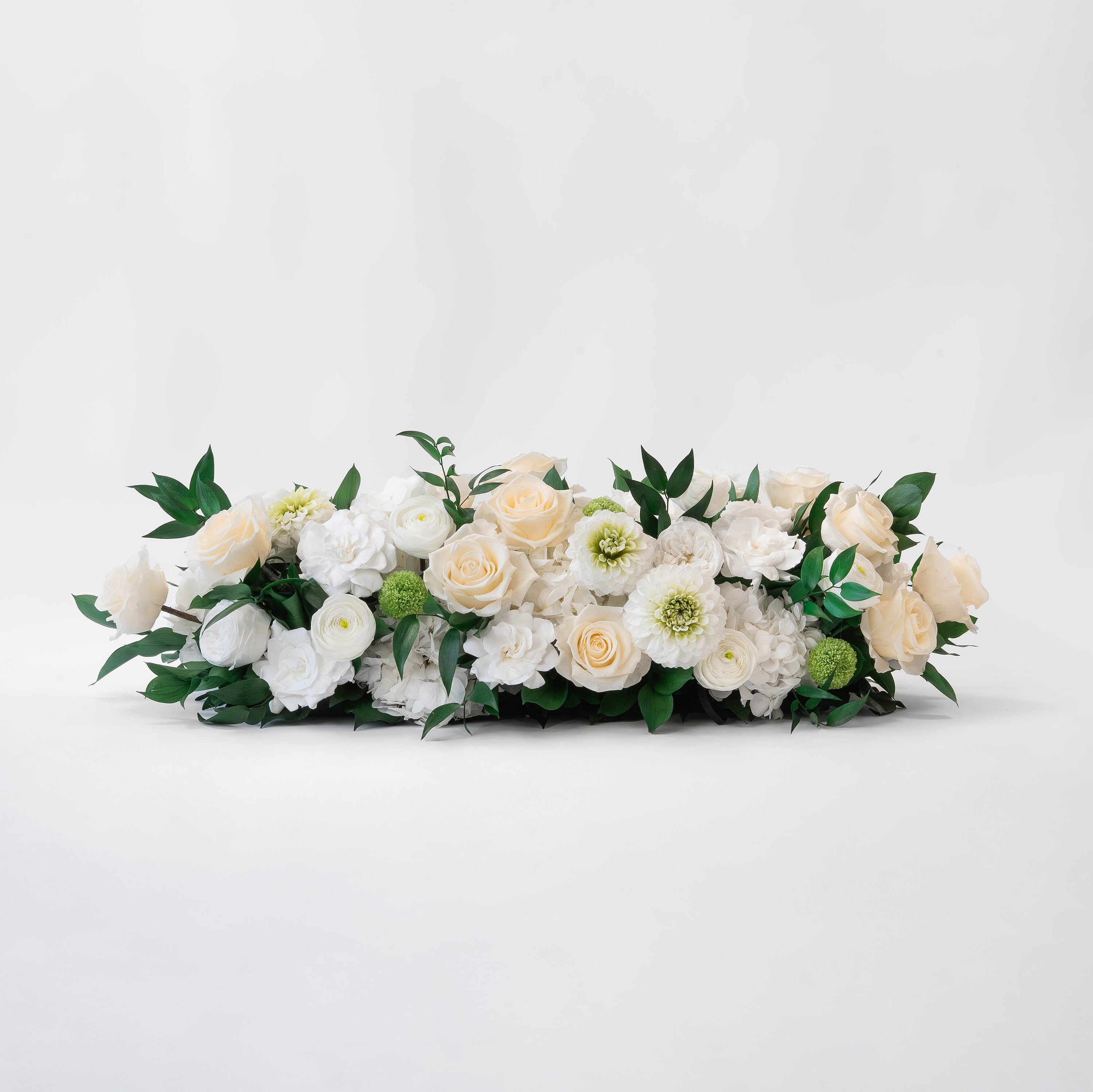 Preserved white and green tropical mixed flower tray long low arrangement for yachts