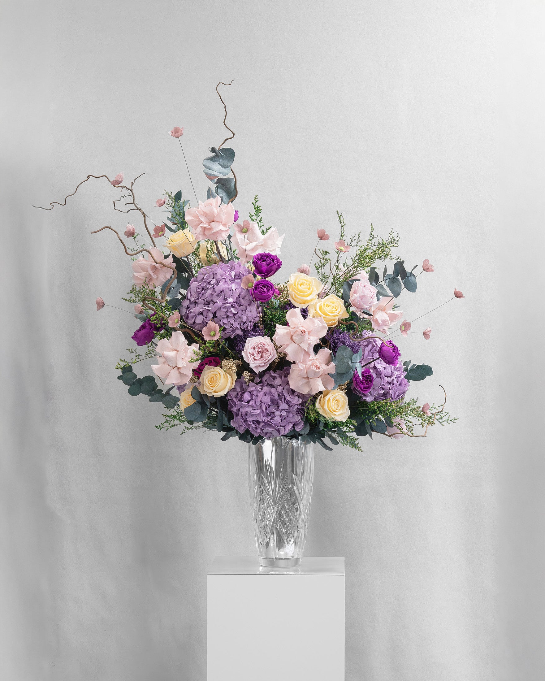 Preserved purple and dusty pink mixed flower arrangement 