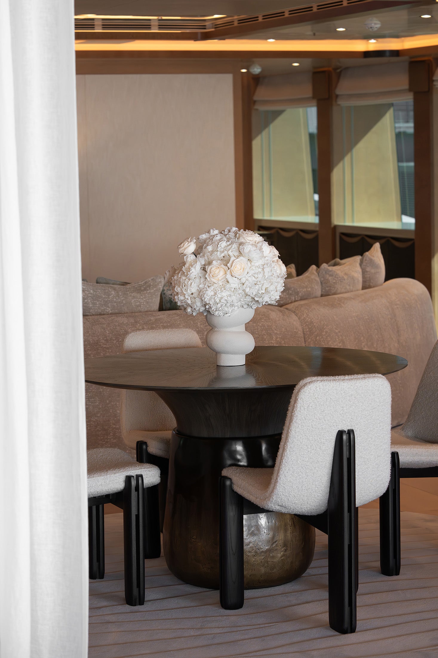 Preserved hydrangea and rose arrangements displayed on the bar in the yacht’s main saloon