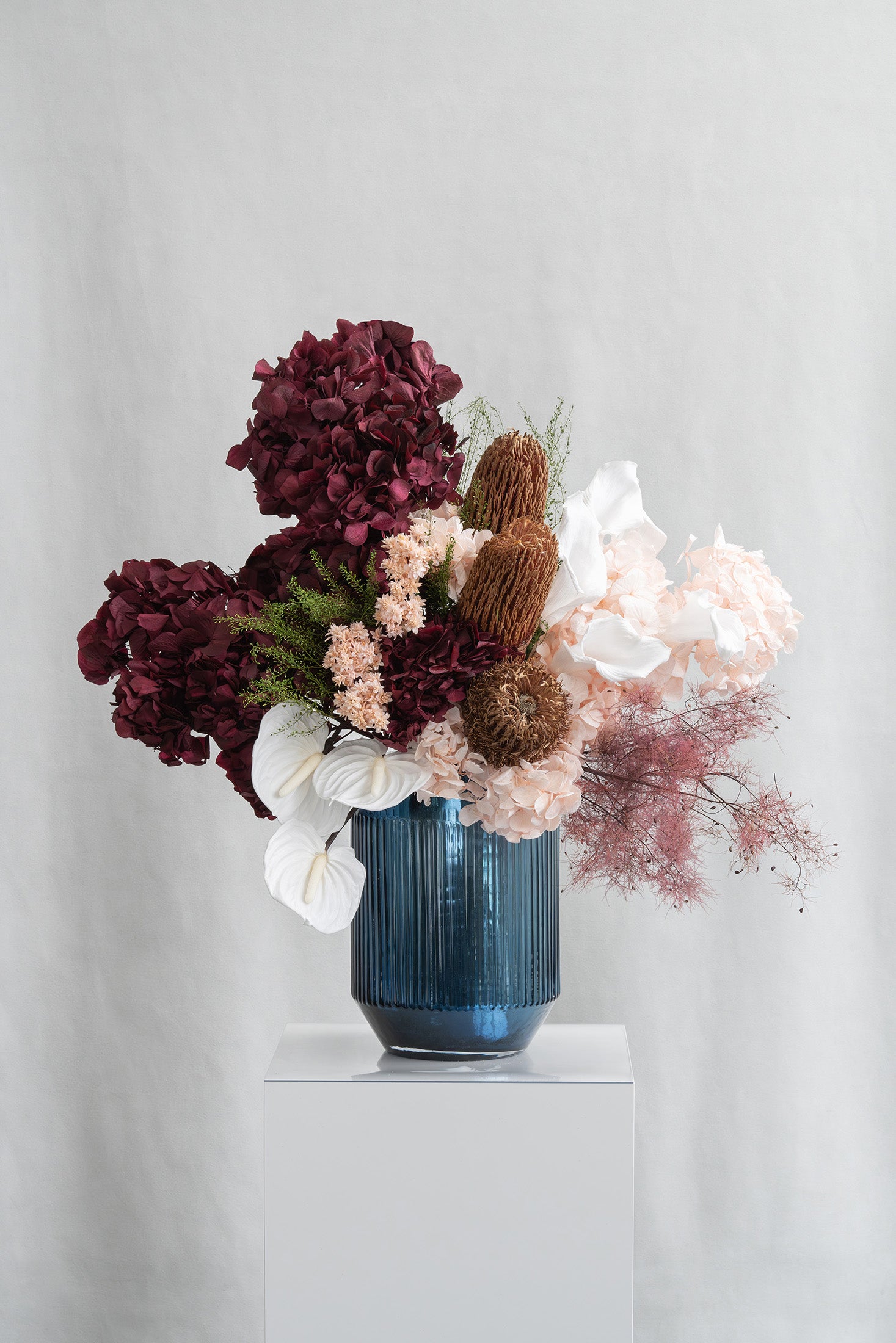 Preserved hydrangea, calla lily, anthurium, star flowers arrangement