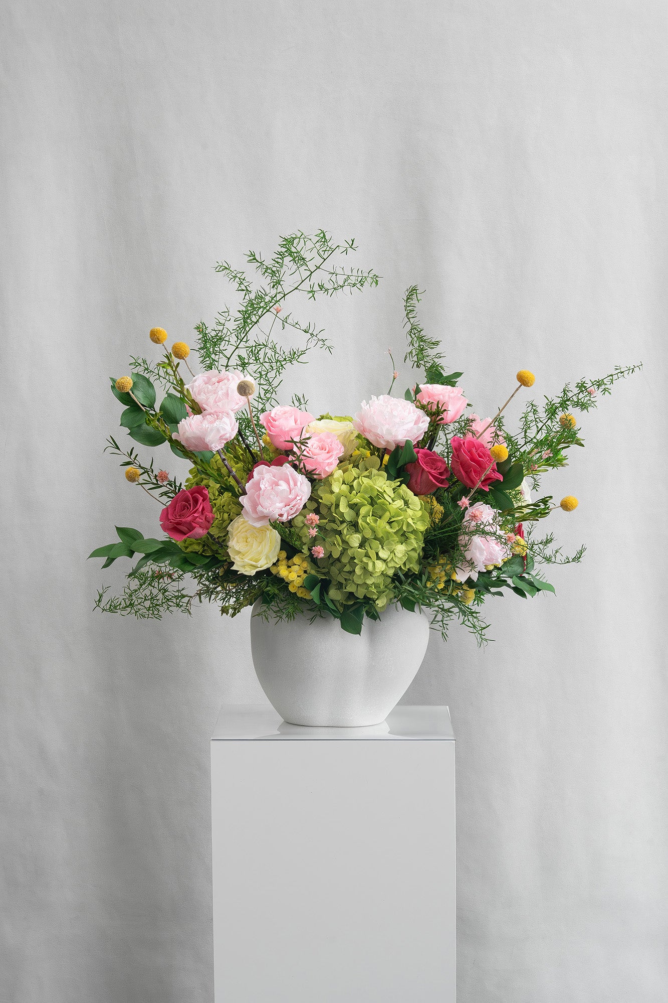 Preserved green and pink mixed flower arrangement 