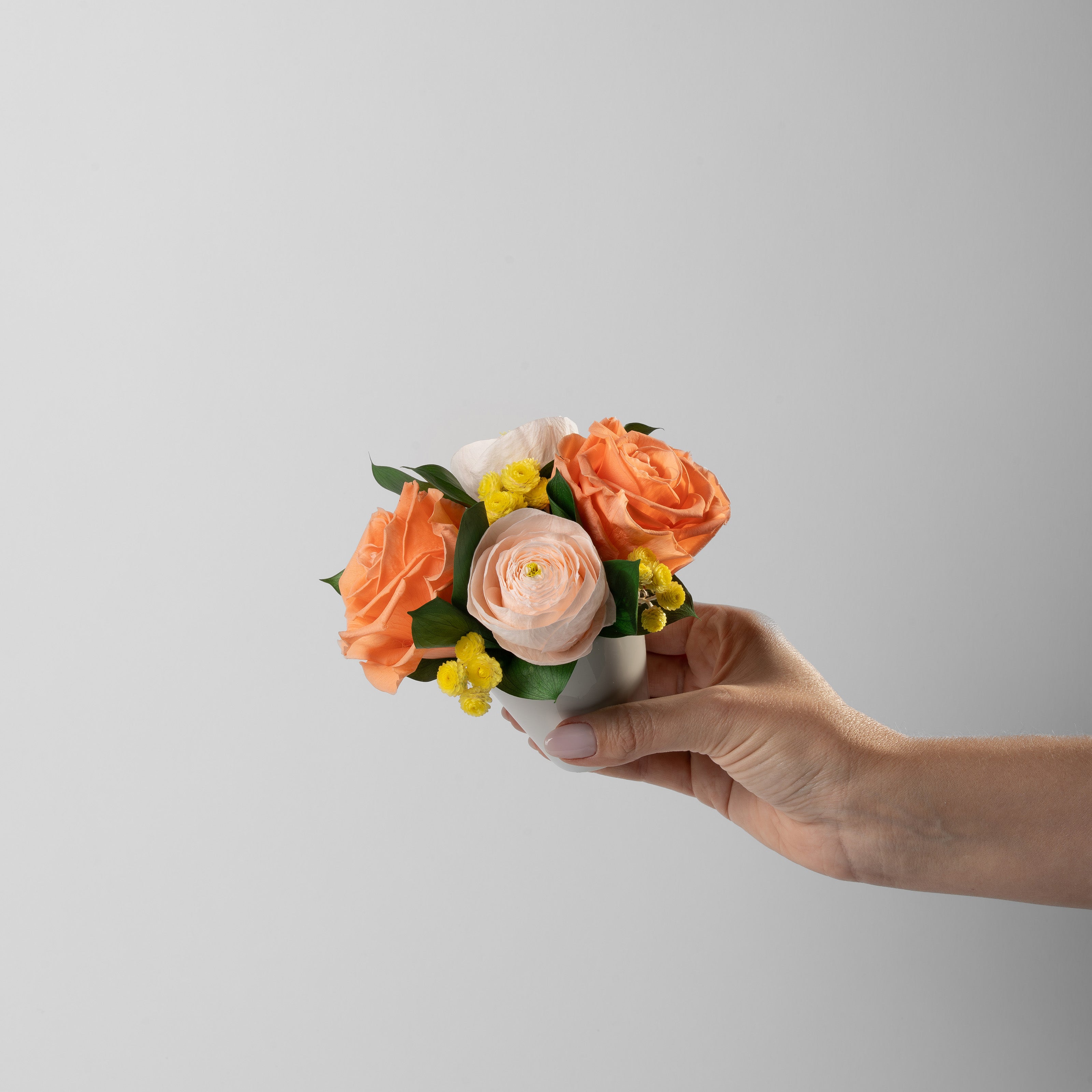 preserved orange and peach flower arrangement for yachts 