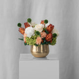 Preserved green, peach and orange flower arrangement for yachts