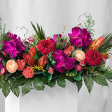 Preserved purple, green and red tropical long low tray flower arrangement for yachts 