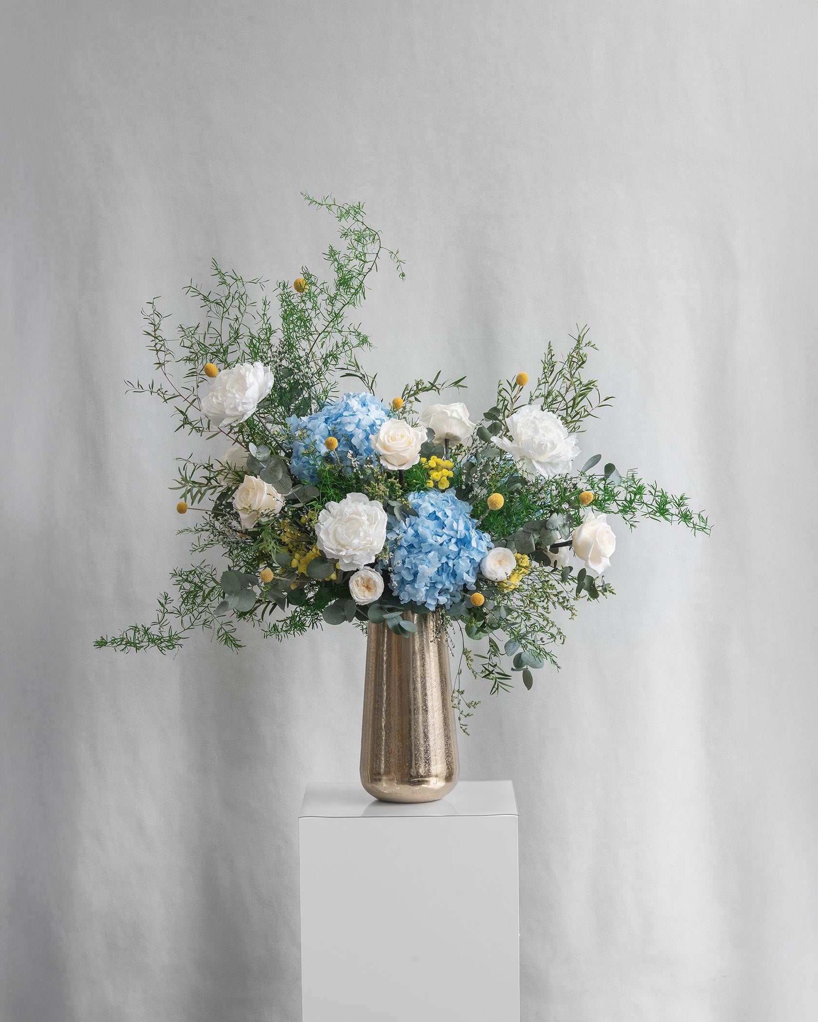 Preserved blue and white mixed flower arrangement 
