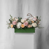 Preserved toffee, peach and blush long low flower arrangement for yachts 