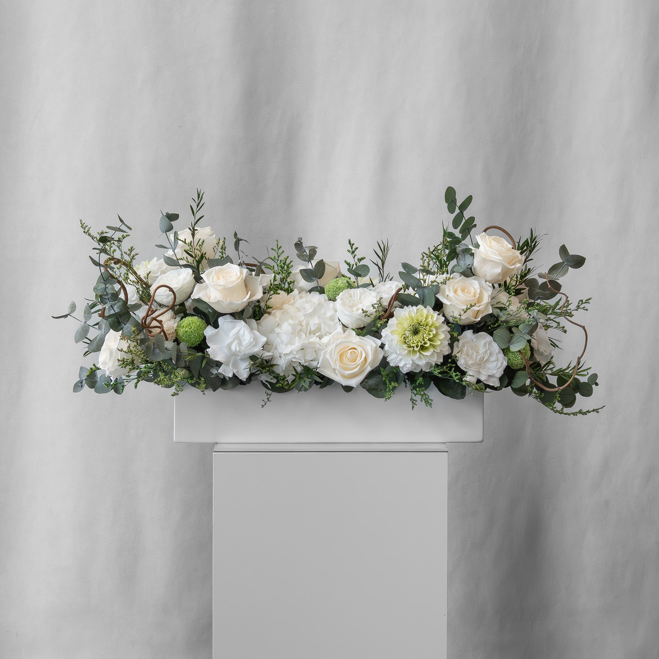 Preserved green and white long low flower arrangement for yachts 