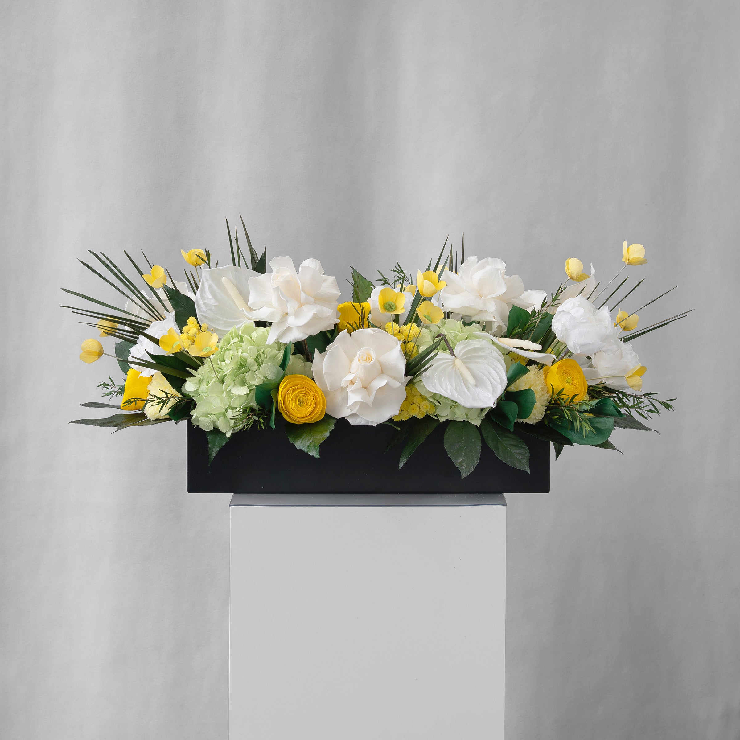 Preserved yellow, green and white tropical long low flower arrangement for yachts 