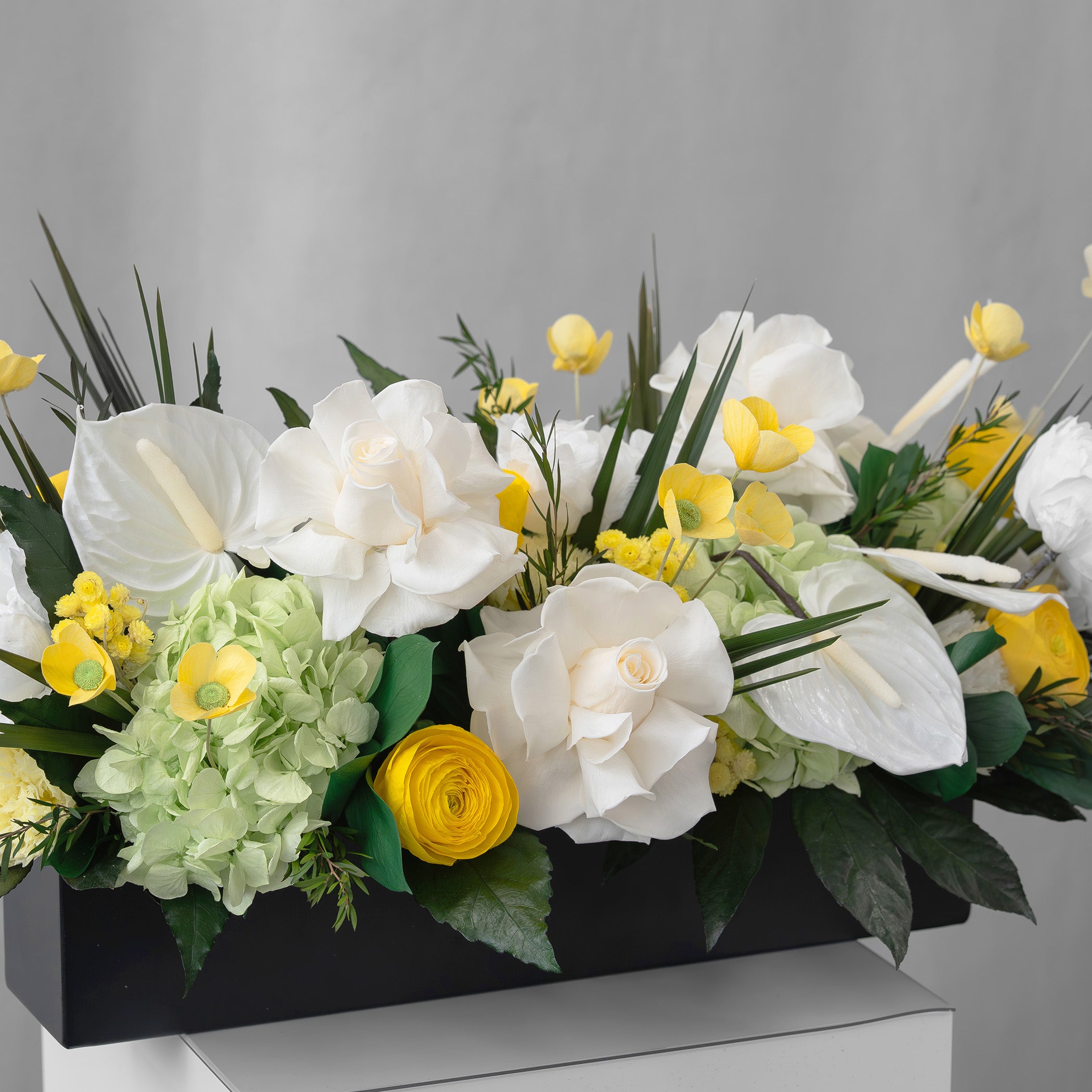 Preserved yellow, green and white tropical long low flower arrangement for yachts 