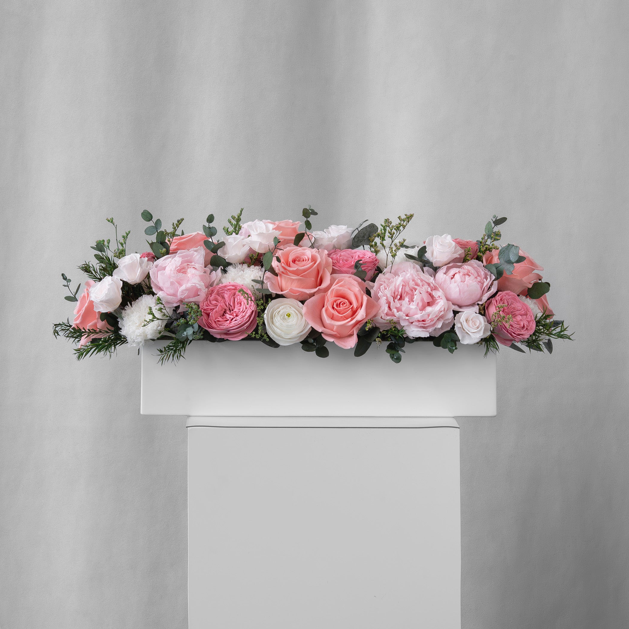 Preserved pink and blush long low flower arrangement for yachts 