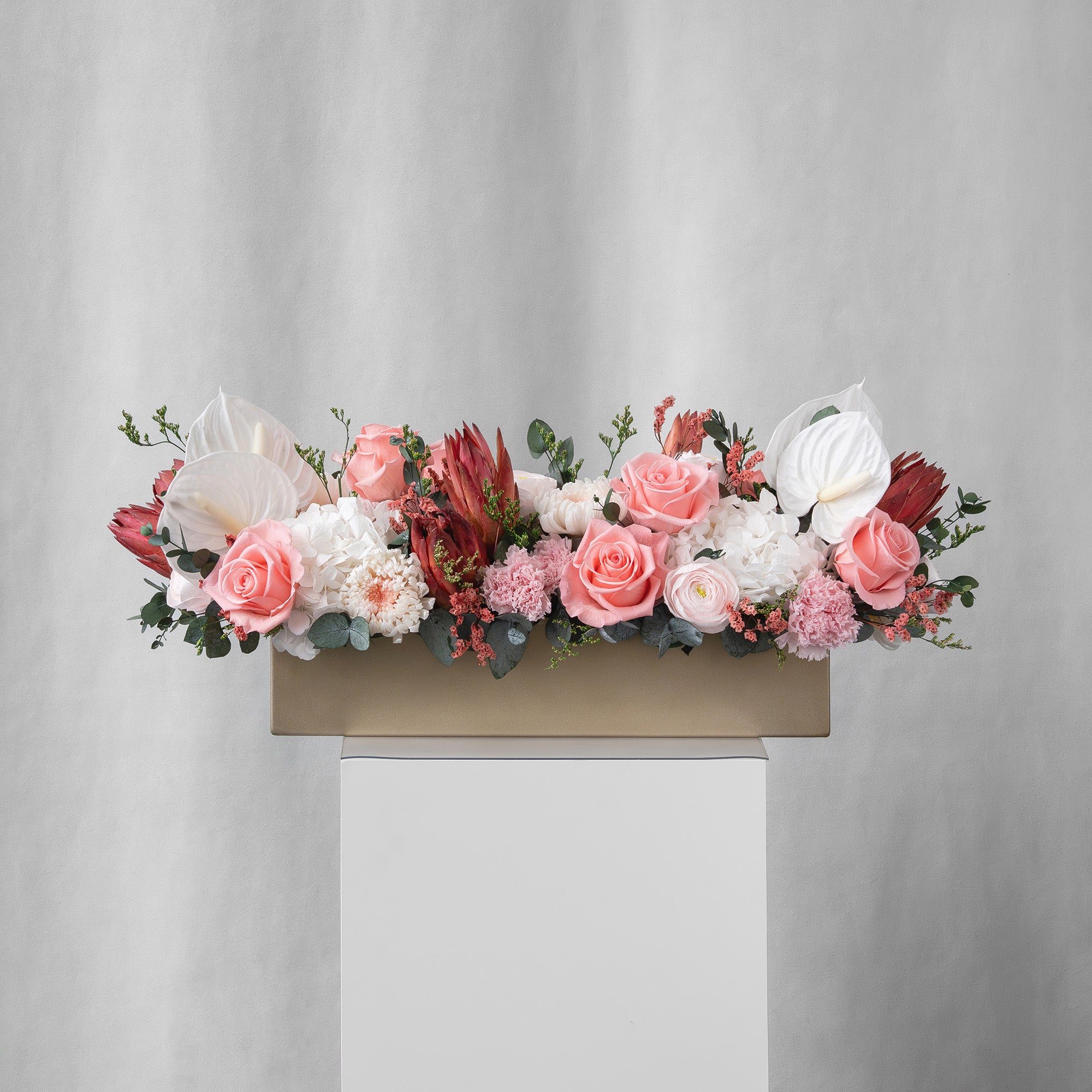 Preserved pink, white and blush long low flower arrangement for yachts 