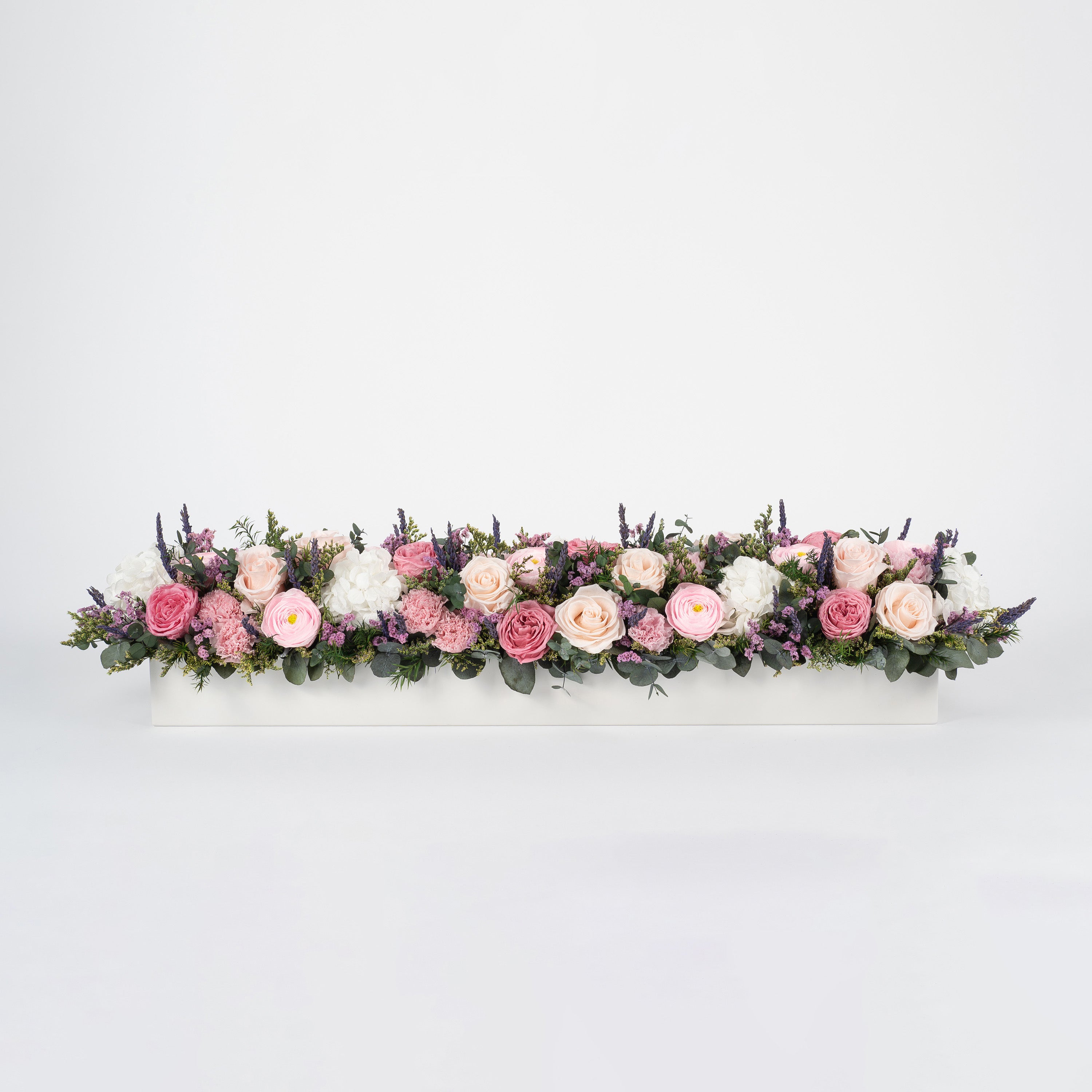 Preserved pink and blush long low flower arrangement for yachts 