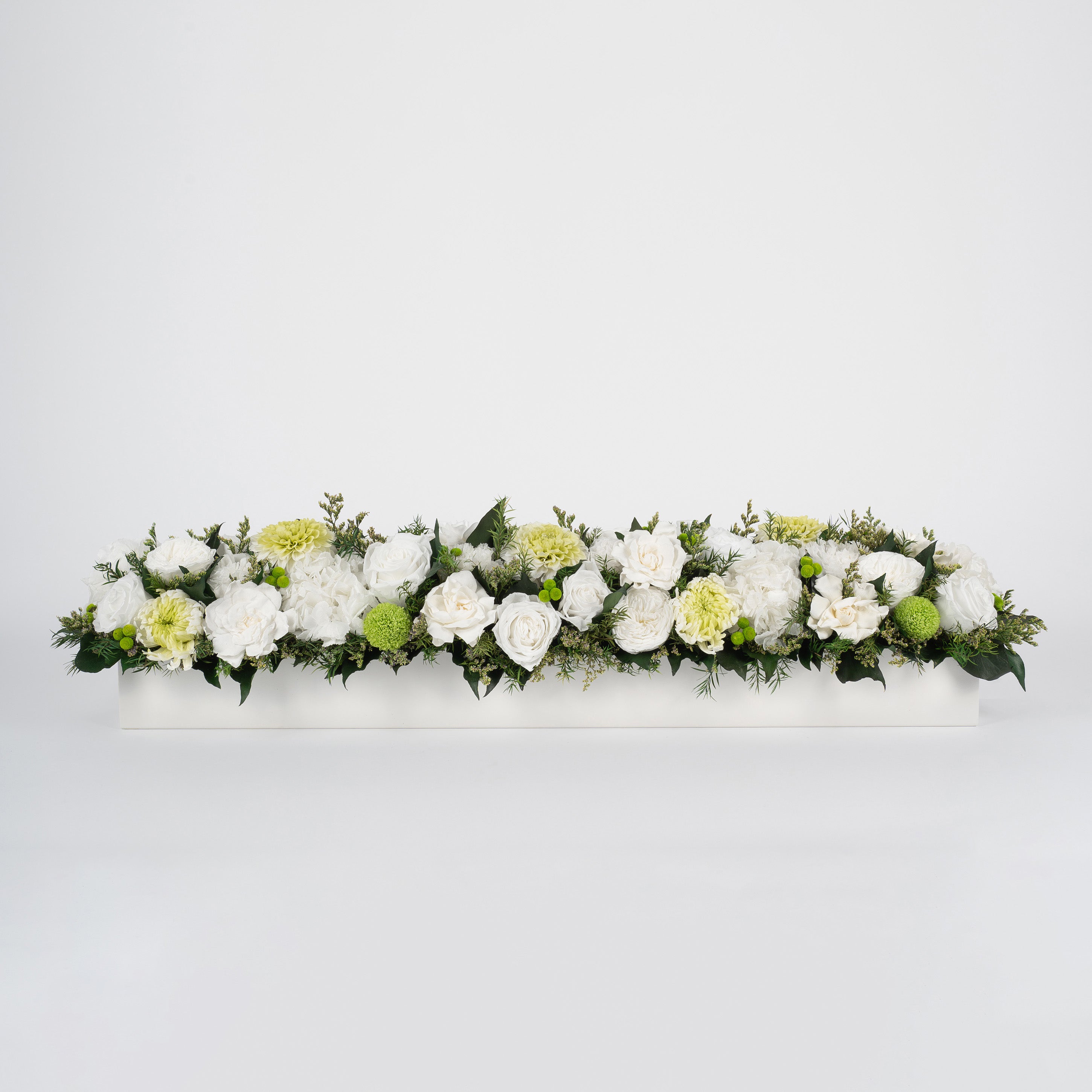 Preserved green and white tropical long low flower arrangement for yachts 