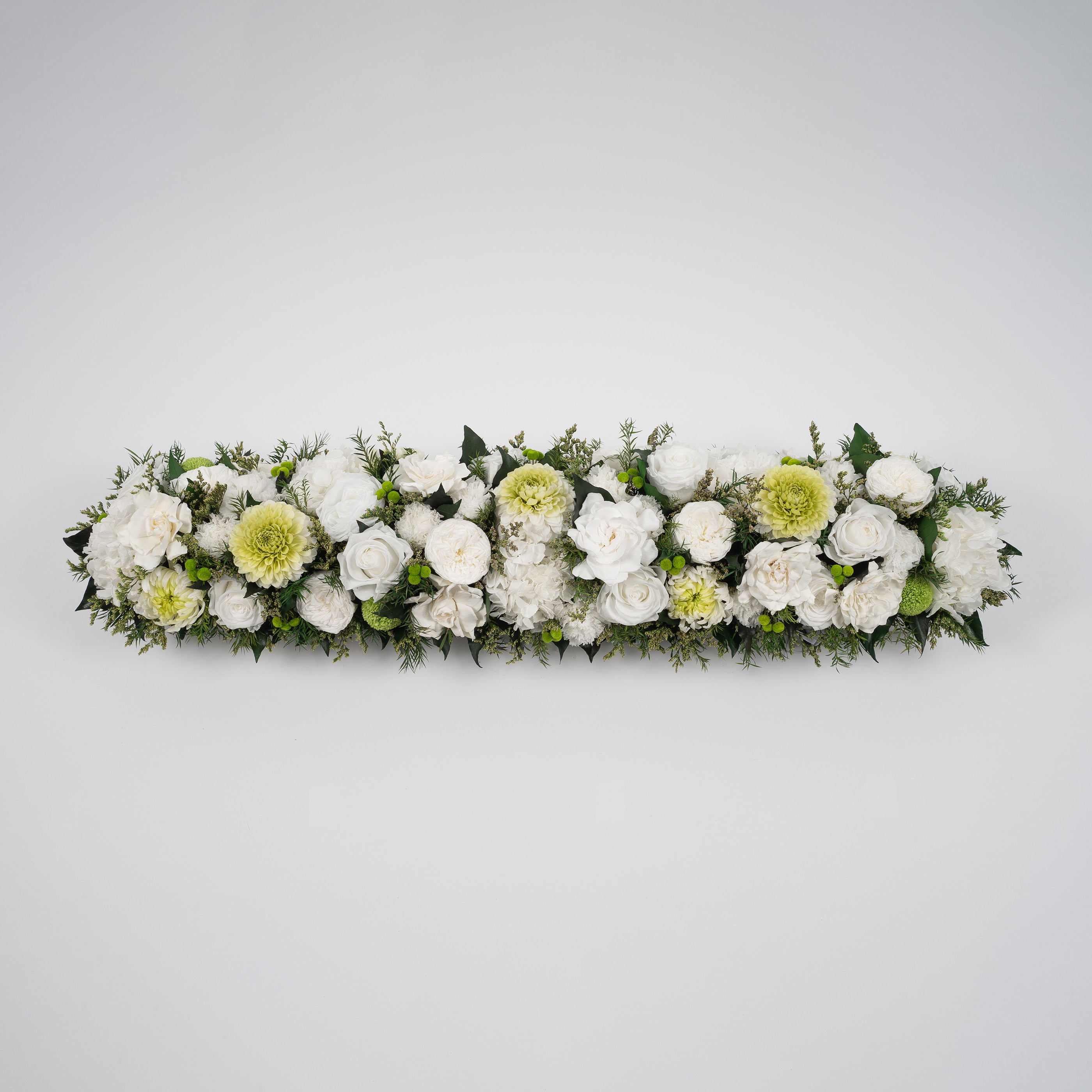 Preserved green and white tropical long low flower arrangement for yachts 
