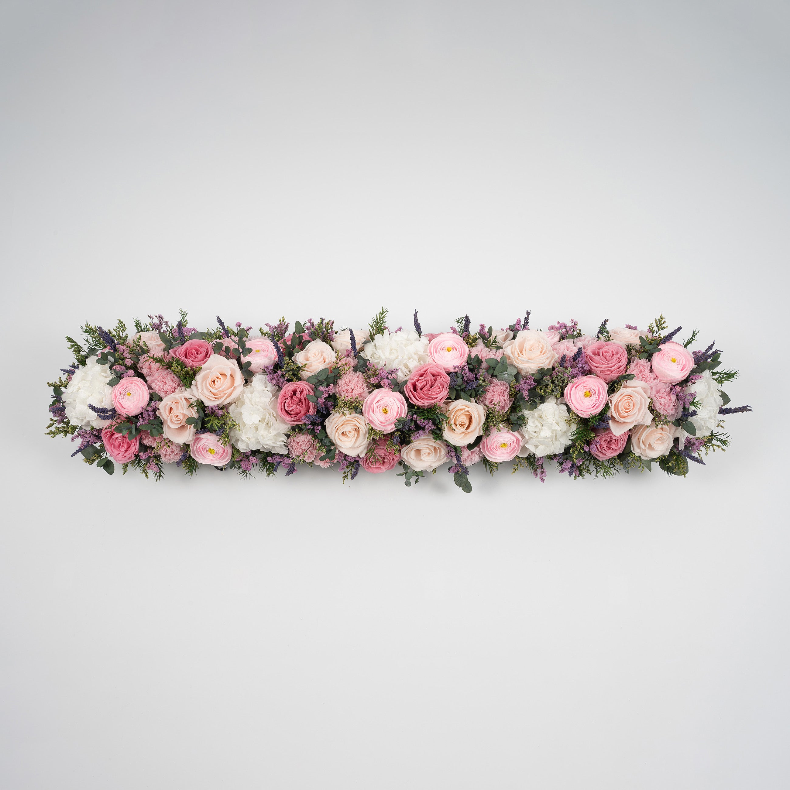 Preserved pink and blush long low flower arrangement for yachts 