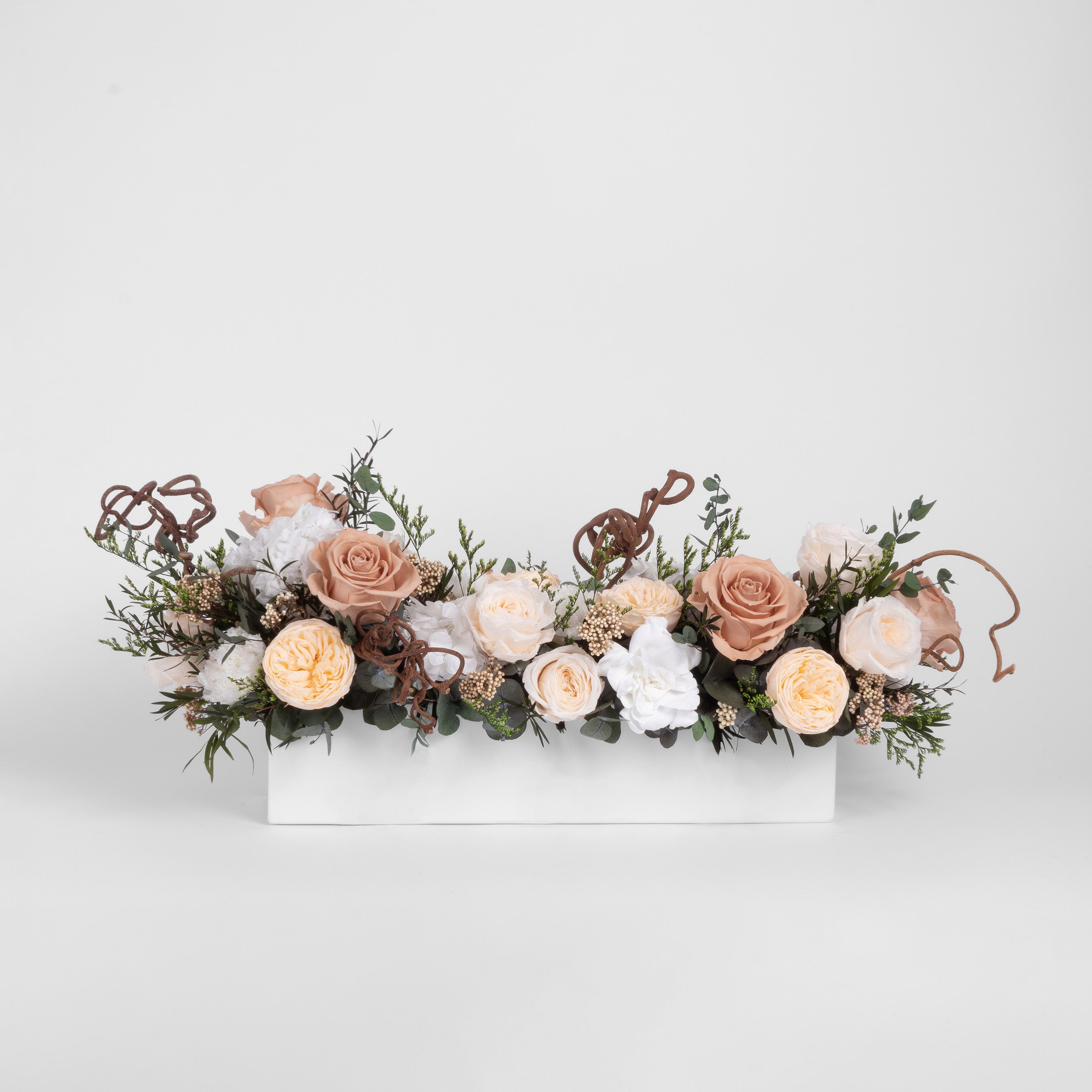 Preserved toffee and white long low flower arrangement for yachts 