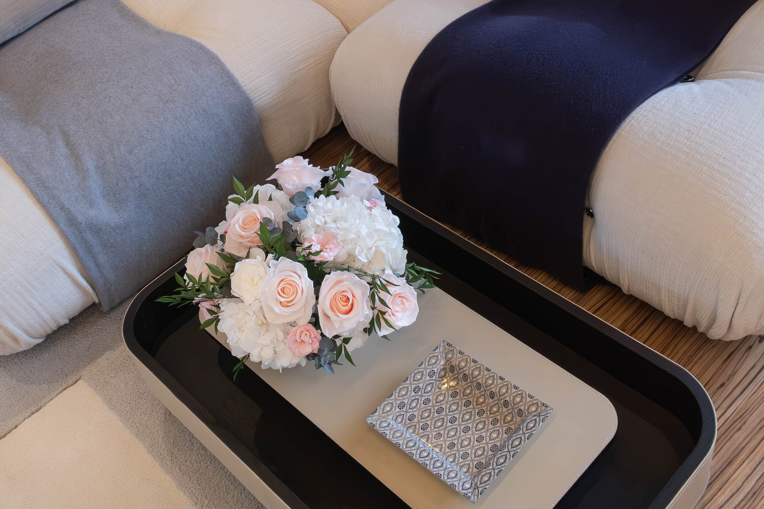 Preserved white and pink mixed flower arrangement in main salon