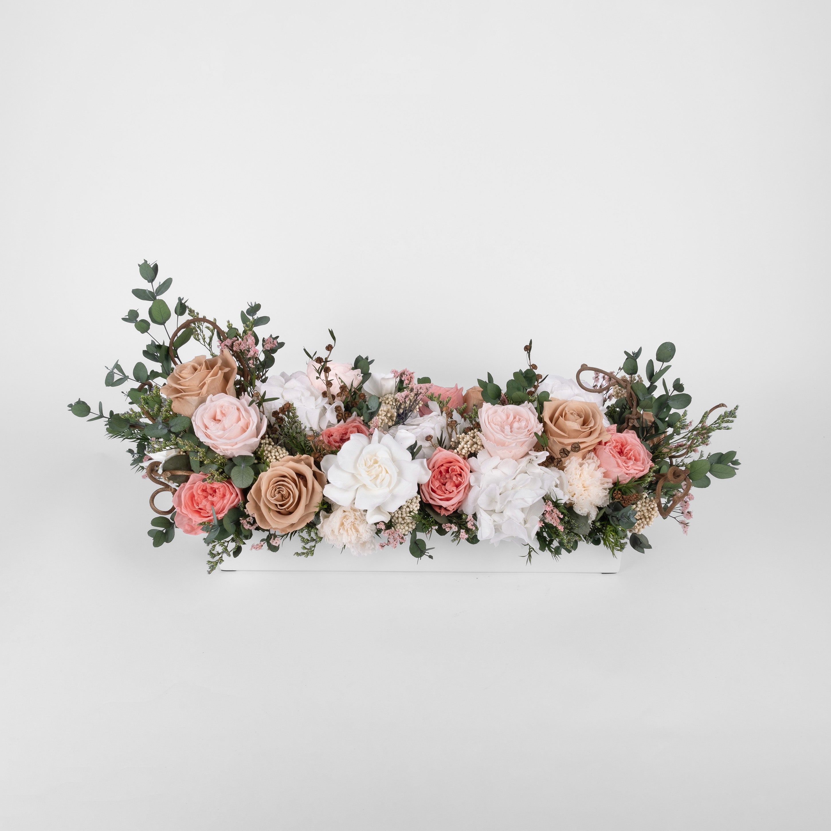 Preserved pink, toffee and blush long low flower arrangement for yachts 