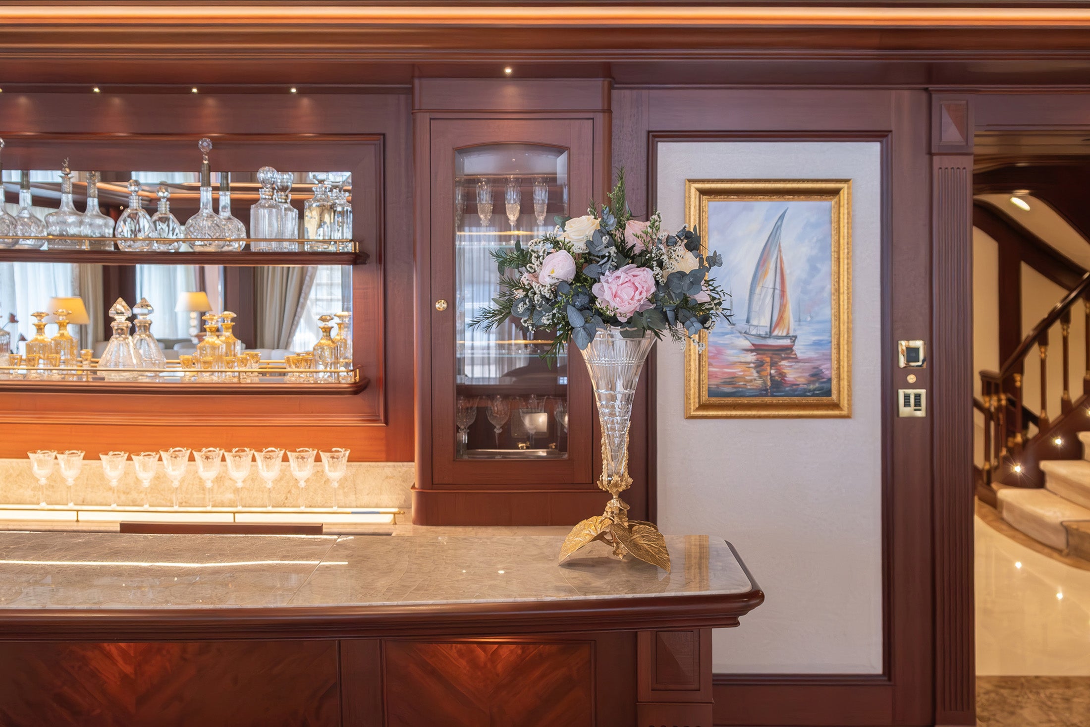 Preserved wild peony, ranunculus and rose with eucalyptus arrangement in main salon