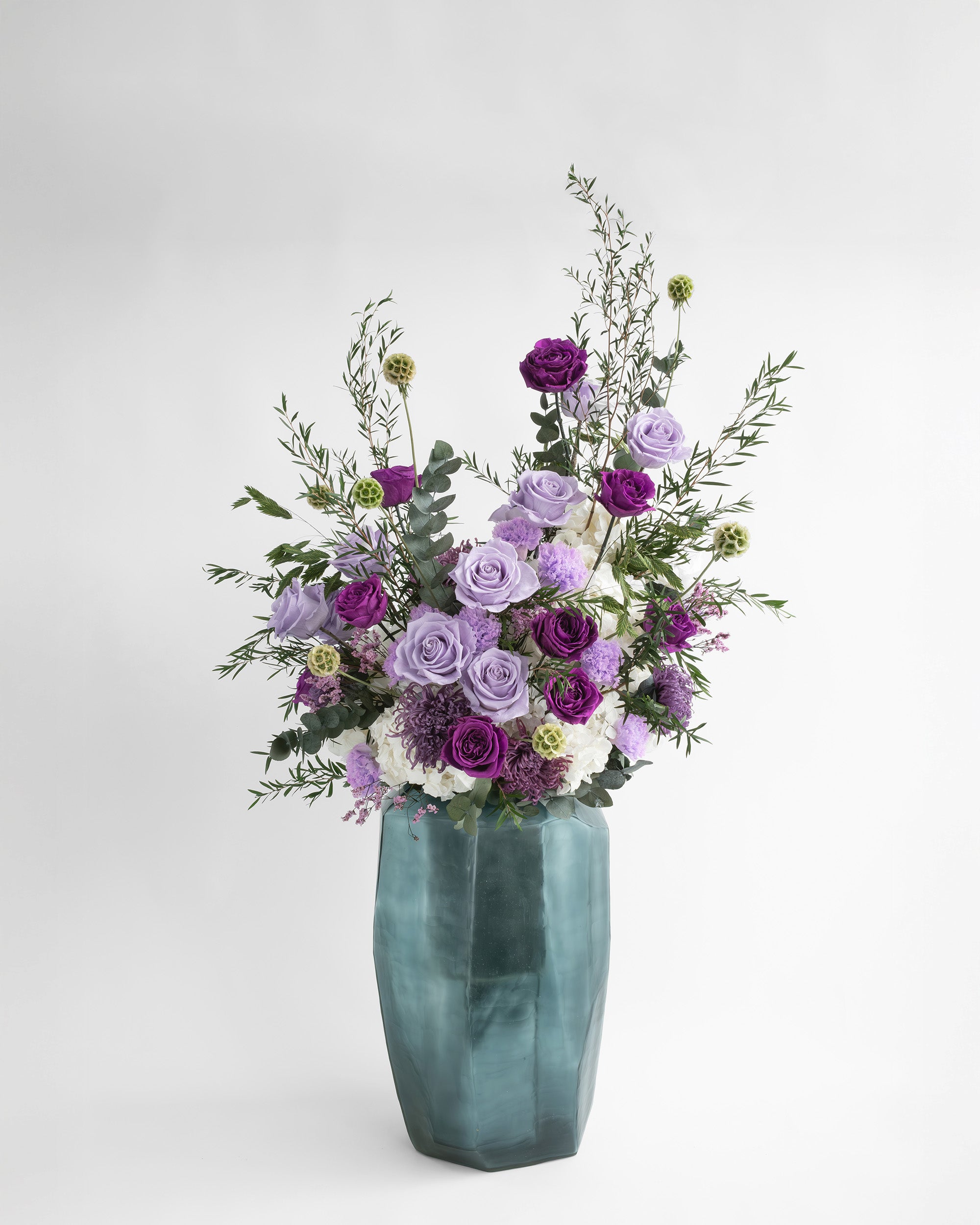 Preserved purple and violet mixed flower arrangement 
