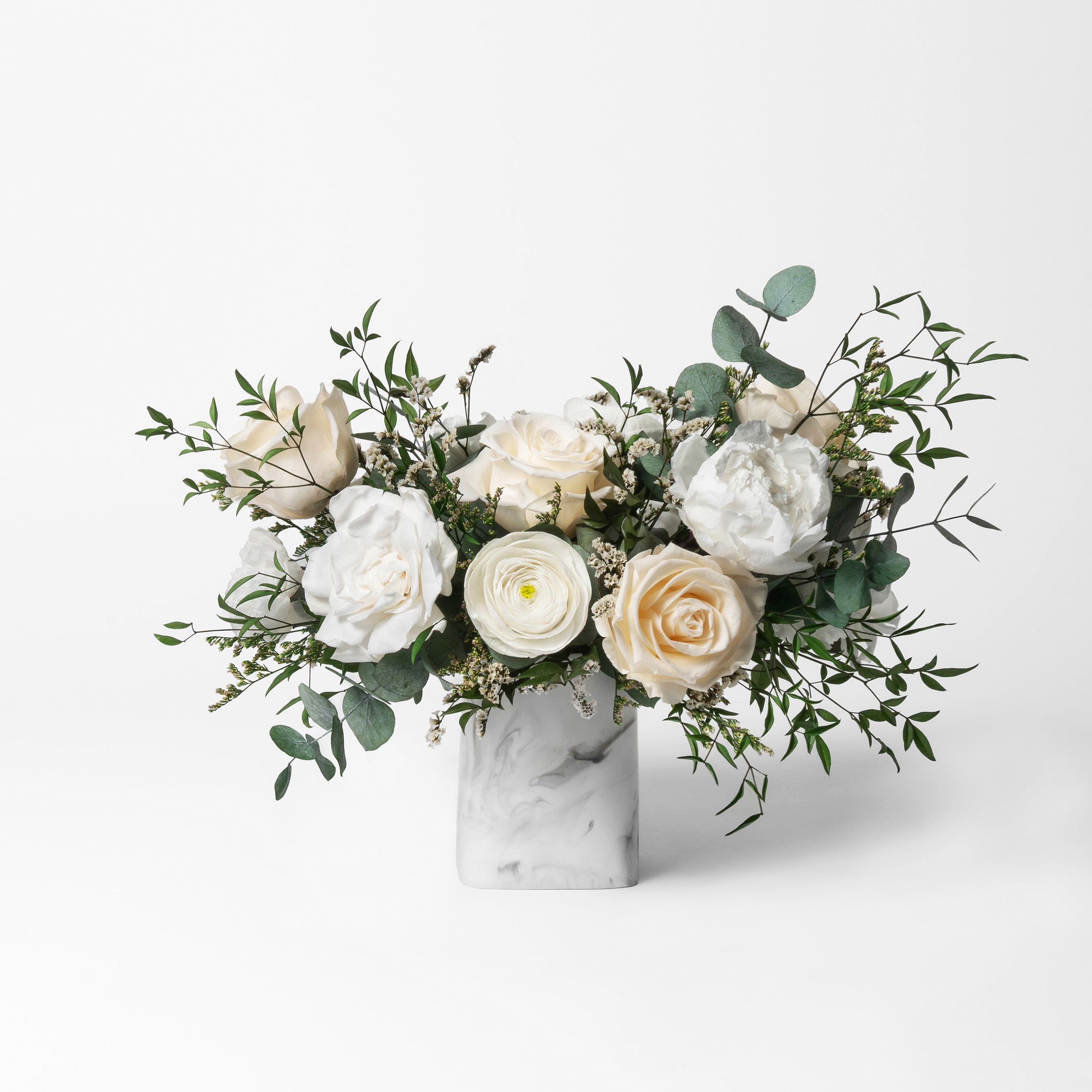 PRESERVED WHITE MIXED FLOWER ARRANGEMENT IN MARBLE VASE