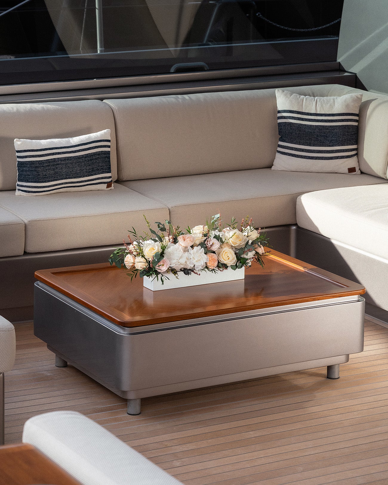 Preserved Flower Arrangement in long low vase on a sailing yacht.