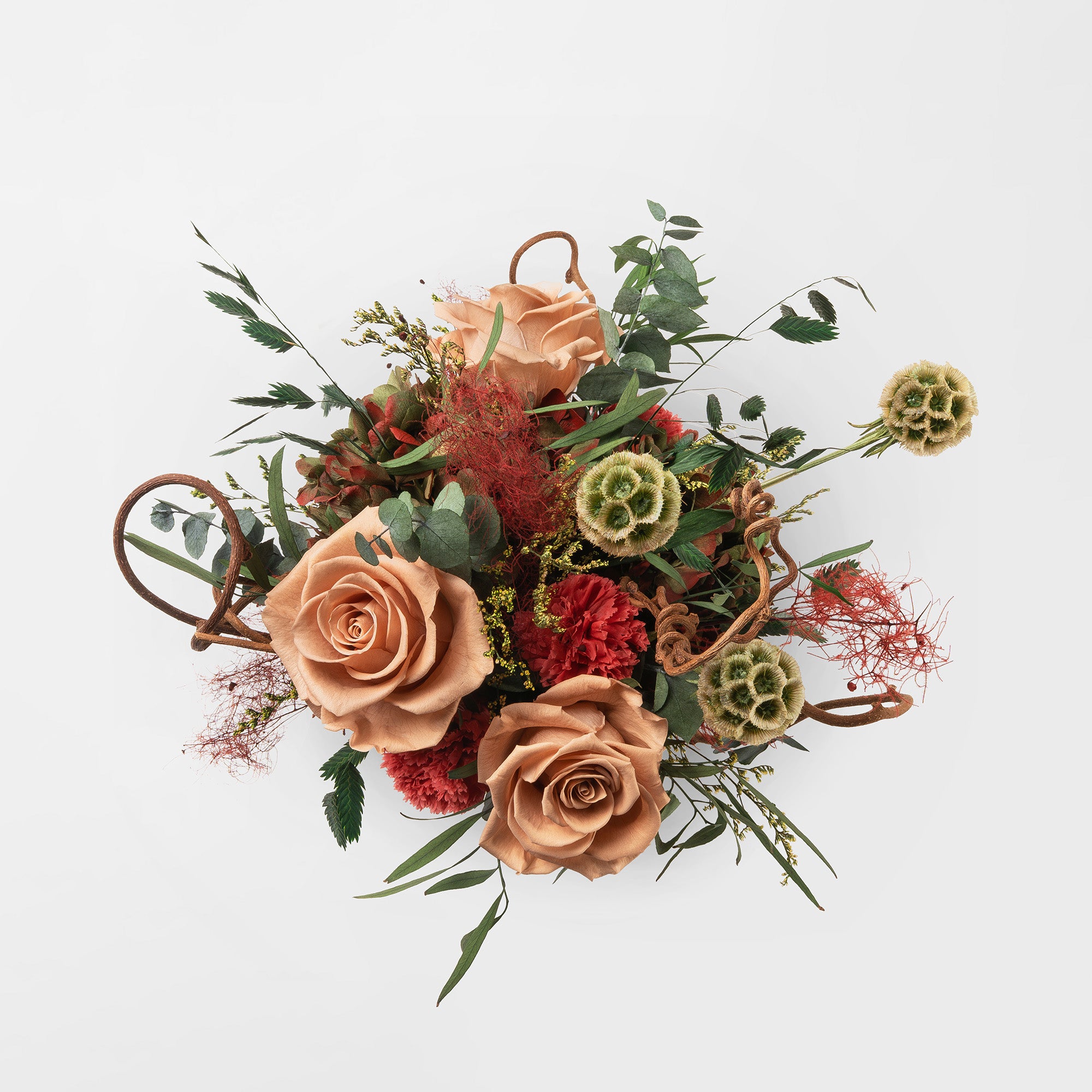 Preserved green and toffee floral arrangement in a ceramic vase for yachts interior. 