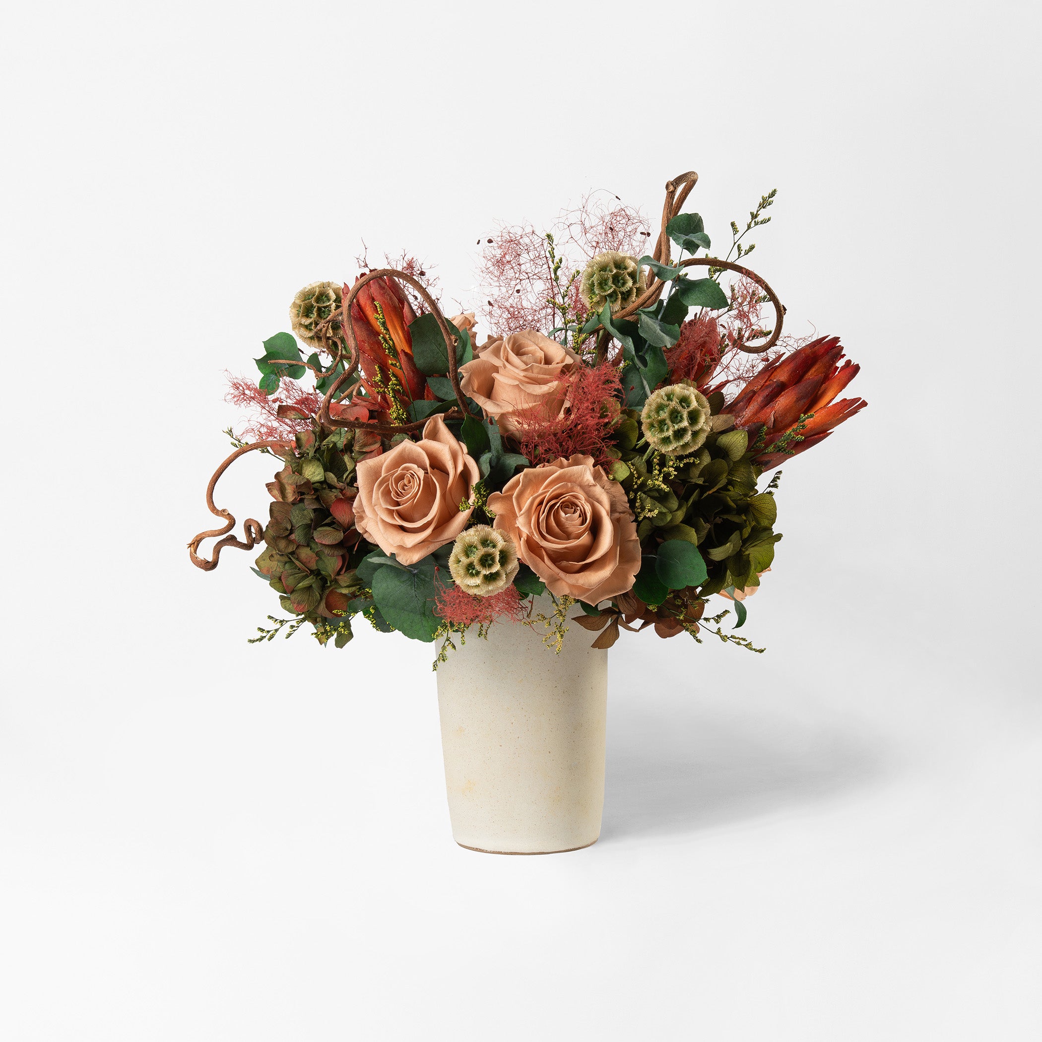 Bouquet of toffee and green mix preserved flowers in a ceramic vase for yachts