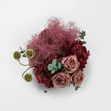 Preserved burgundy hydrangea flower arrangement in stone vase 