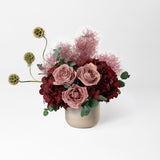 Preserved burgundy hydrangea flower arrangement in stone vase 