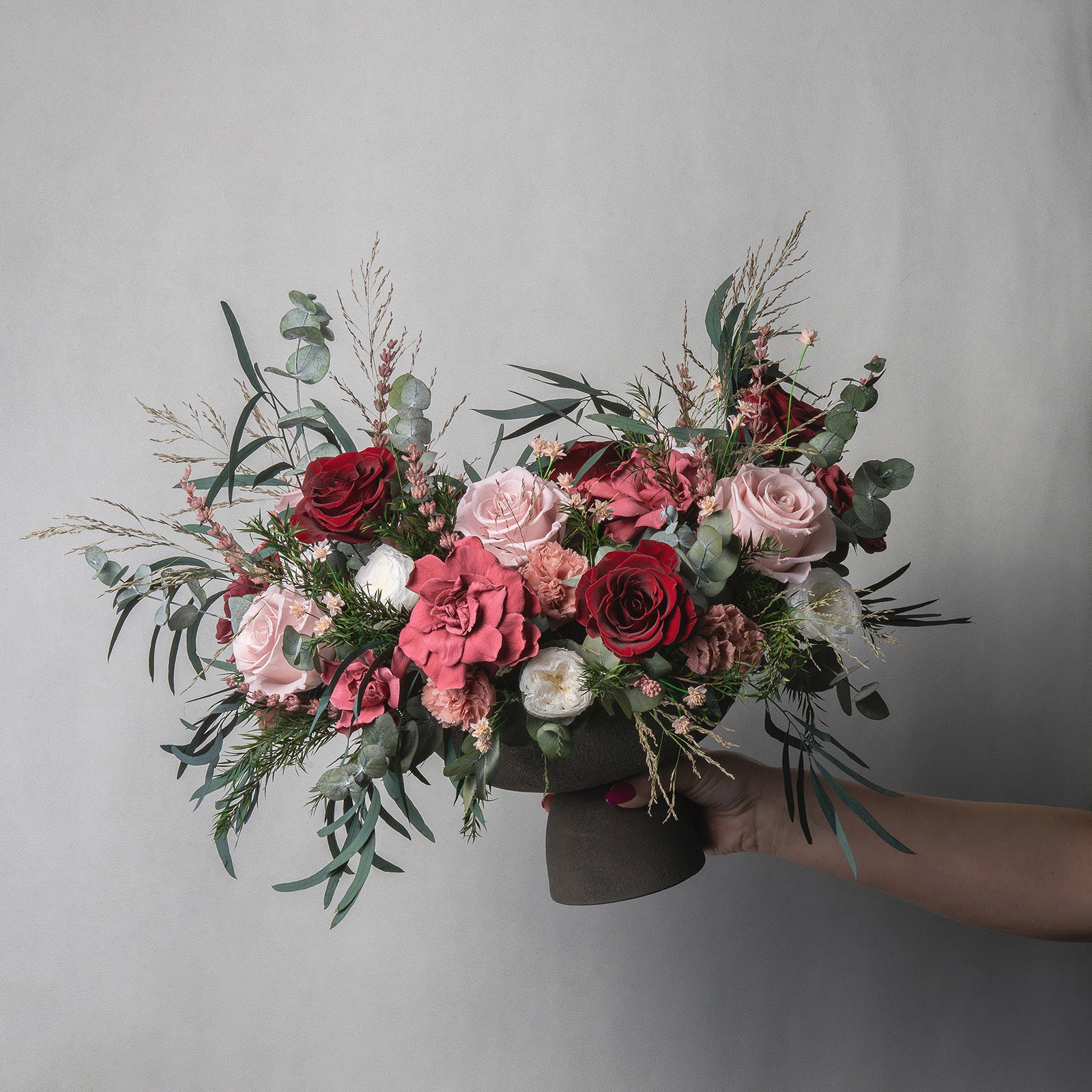 PRESERVED BURGUNDY & CHERRY MIXED FLOWER ARRANGEMENT IN GREY FOOTED VASE FOR YACHTS