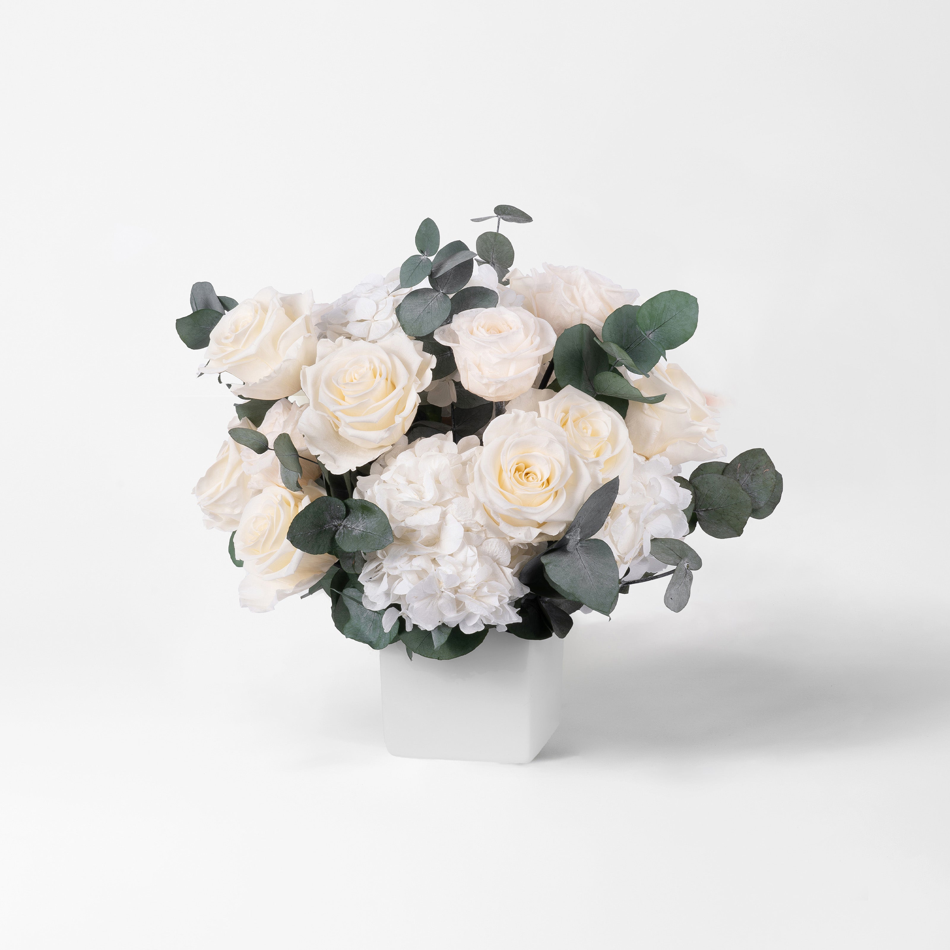 PRESERVED WHITE ROSE AND HYDRANGEA ARRANGEMENT IN WHITE CUBE VASE FOR YACHTS