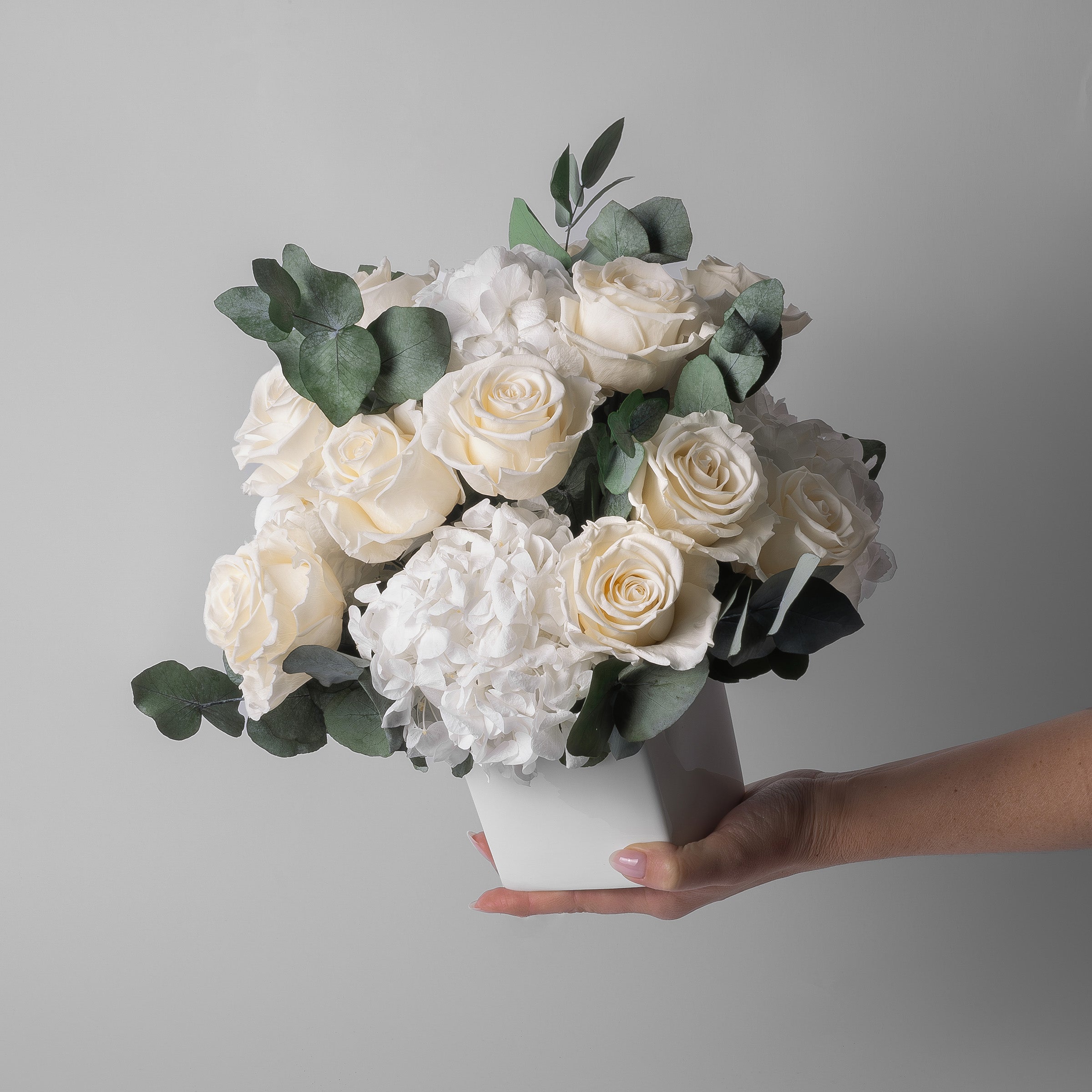 PRESERVED WHITE ROSE AND HYDRANGEA ARRANGEMENT IN WHITE CUBE VASE FOR YACHTS