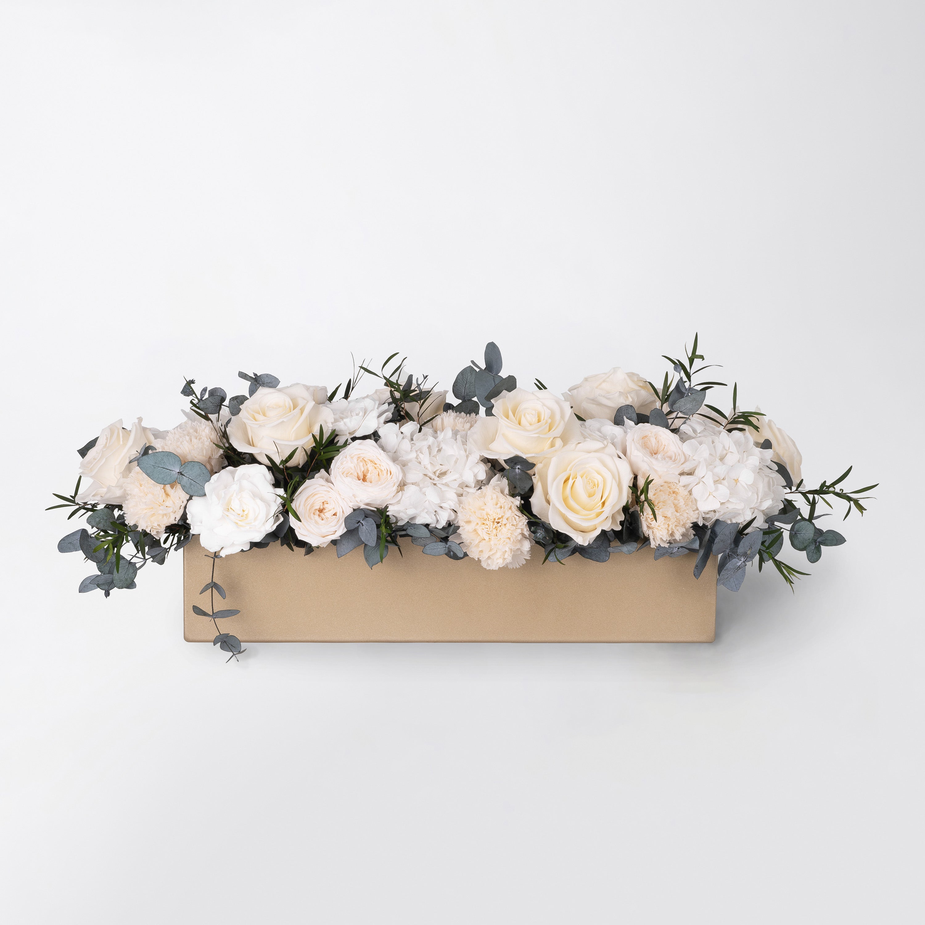 Preserved white and peach long low flower arrangement for yachts 