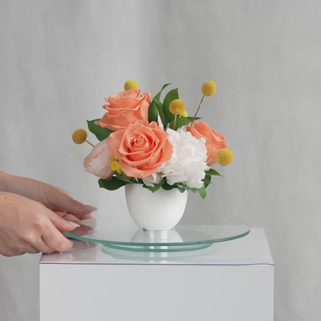 Preserved orange and peach flower arrangement for yachts 